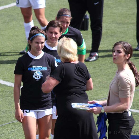 FC Kansas City's Erika Tymrak, Amy LePeilbet, and Nicole Barnhart accepting their medals from NWSL Executive Director Cheryl Bailey after the 2014 NWSL Championship game at Starfire Stadium on August 31, 2014.