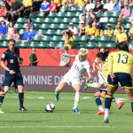 USA's Megan Rapinoe maneuvers against Colombian players.